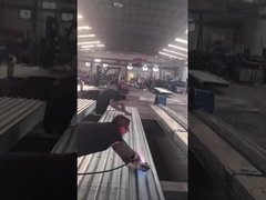 The workers in the steel mill are processing stainless steel angle steel